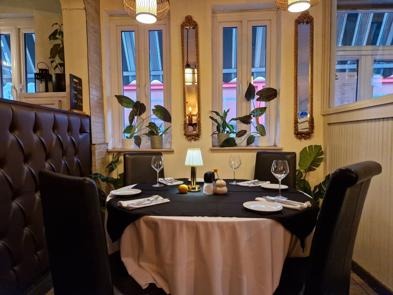 Bella Sera’s own dining room in Heywood, with leather seating and tables set for dinner