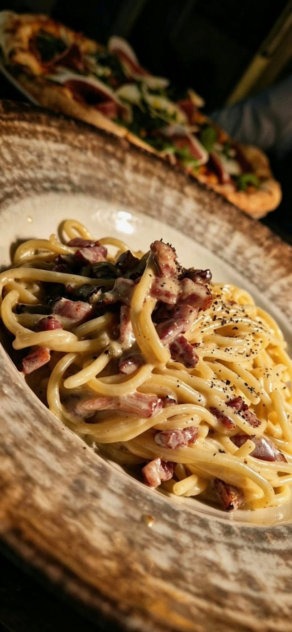 Pasta with mushrooms served on a patterned plate